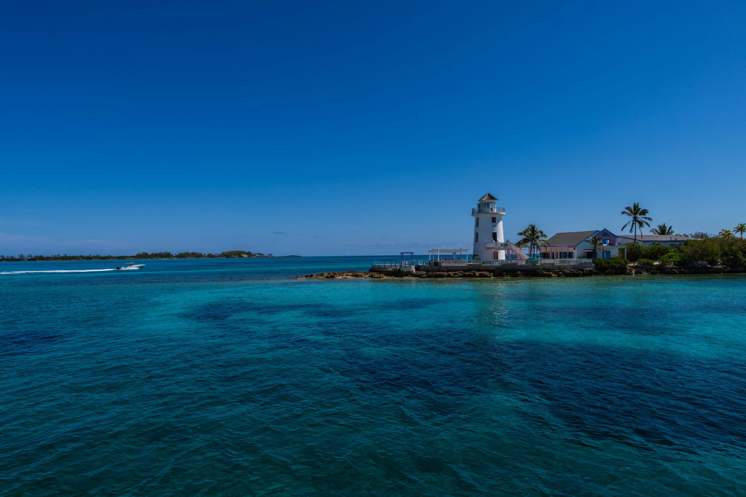 Coastal lighthouse over turquoise water in Palm Beach County